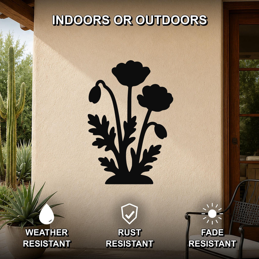 Black metal poppy wall art silhouette with detailed flower and leaf cutouts, mounted on an outdoor patio wall.