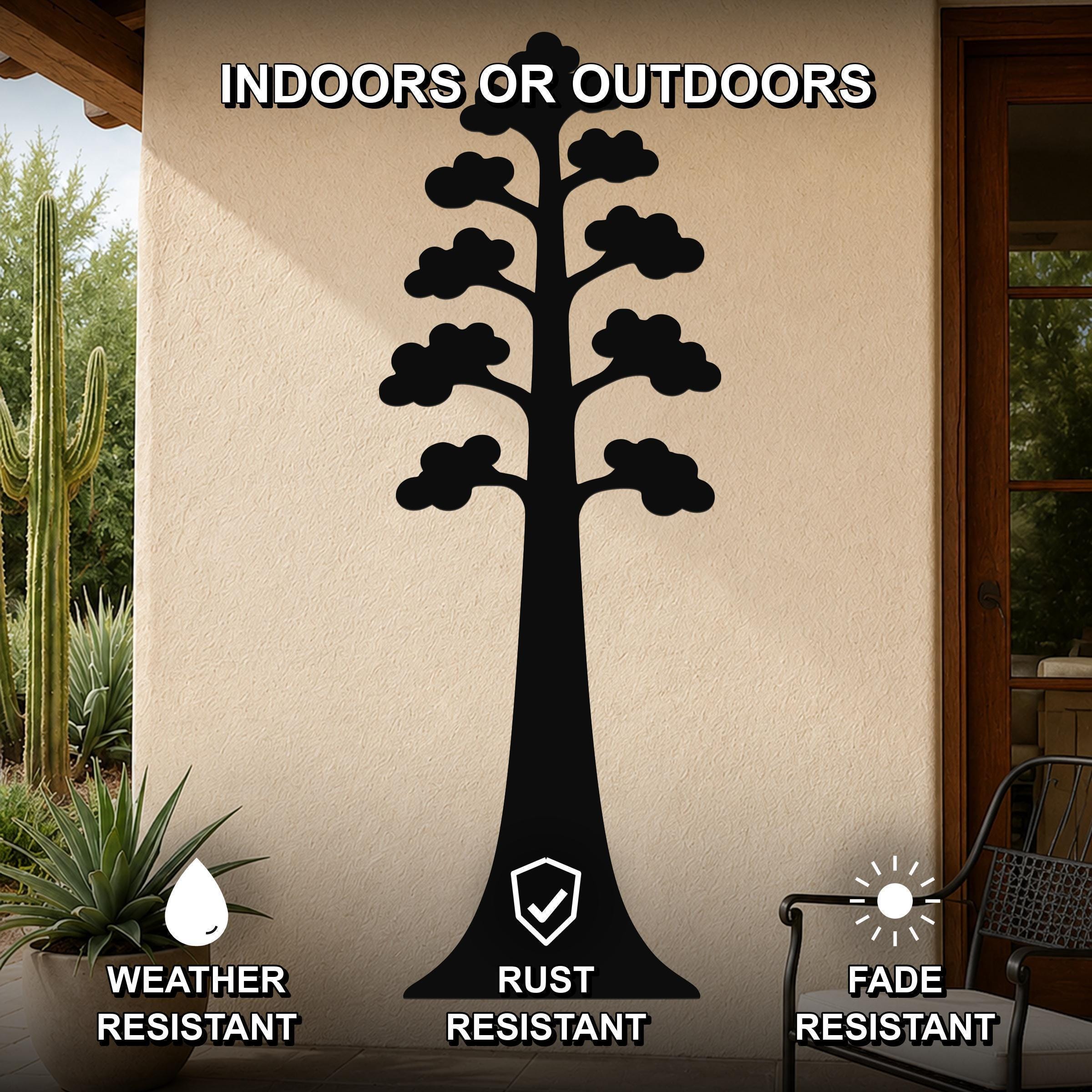 Black metal wall art in the silhouette of a sequoia tree with layered branch cutouts, mounted on an outdoor patio wall.