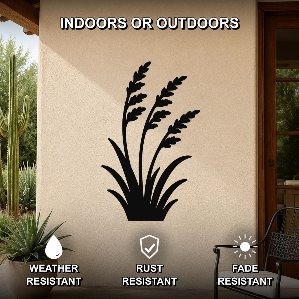 Black metal wall art featuring a wild grass silhouette, mounted on an outdoor patio wall with cactus and potted plant nearby, weather, rust, and fade resistant.