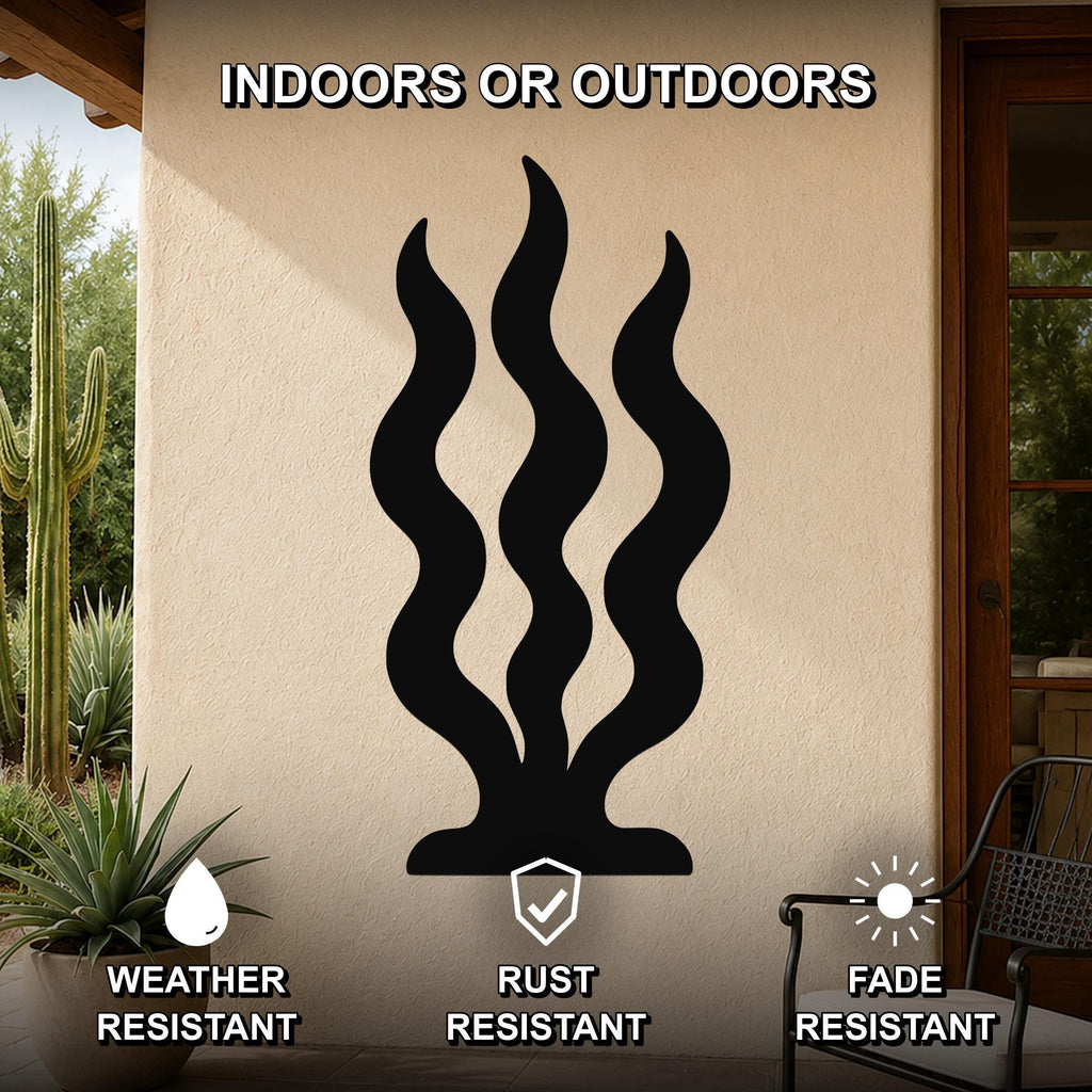 Black metal wall art with wavy grass cutouts, mounted on an outdoor patio wall, weather resistant, rust resistant, and fade resistant.