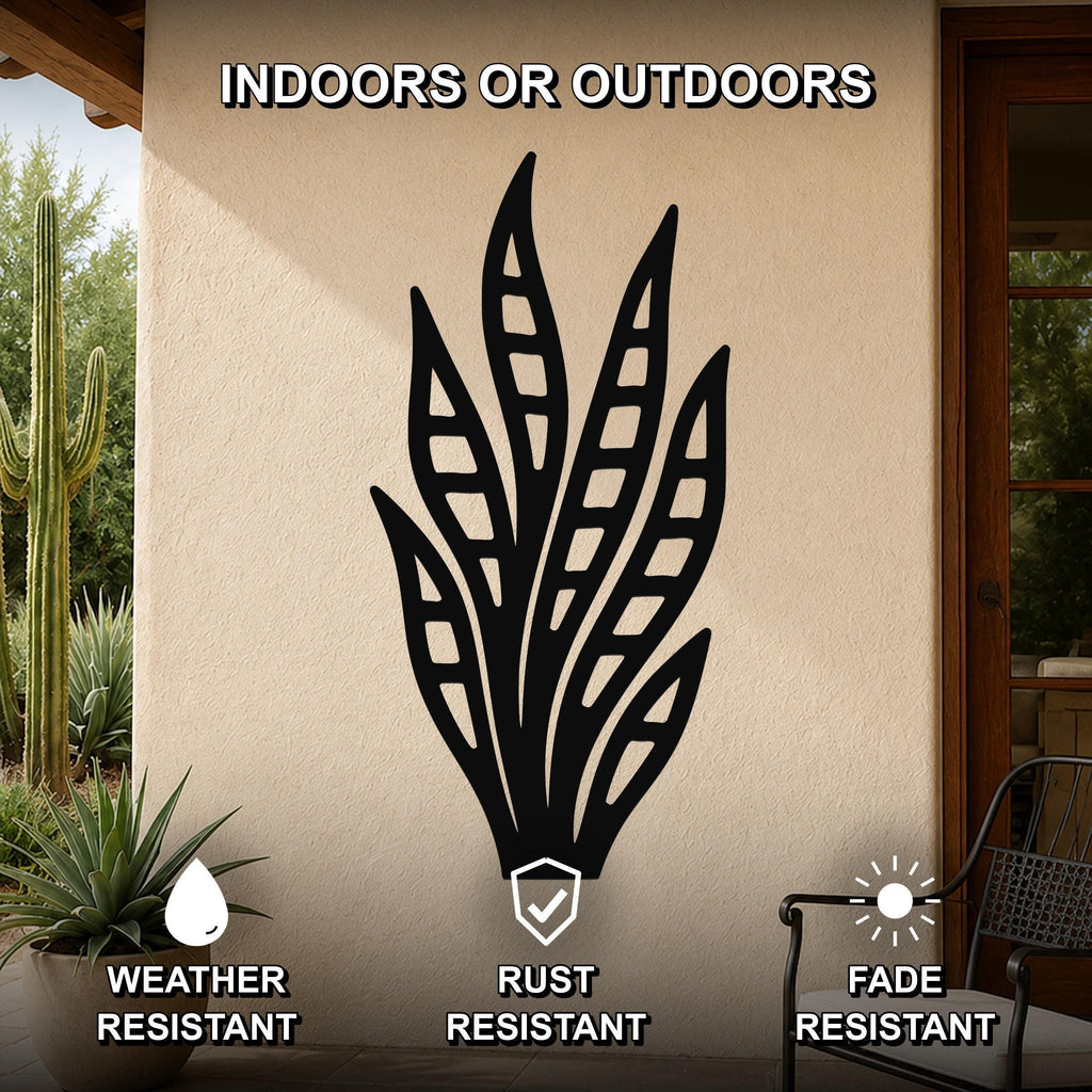 Black metal snake plant wall art with leaf cutouts, mounted on an outdoor patio wall, weather resistant, rust resistant, and fade resistant.