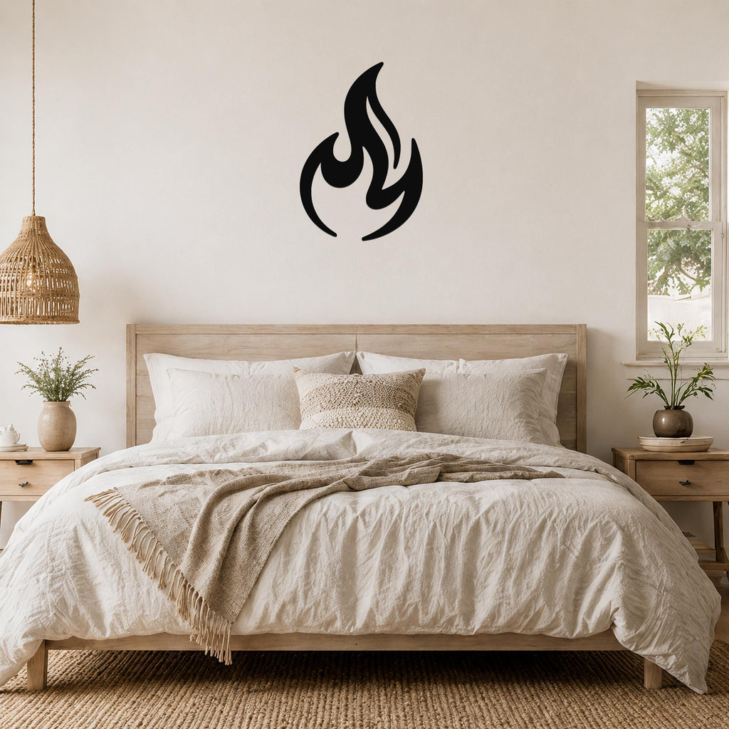 Black metal flame silhouette wall art mounted above a wooden bed in a neutral bedroom.