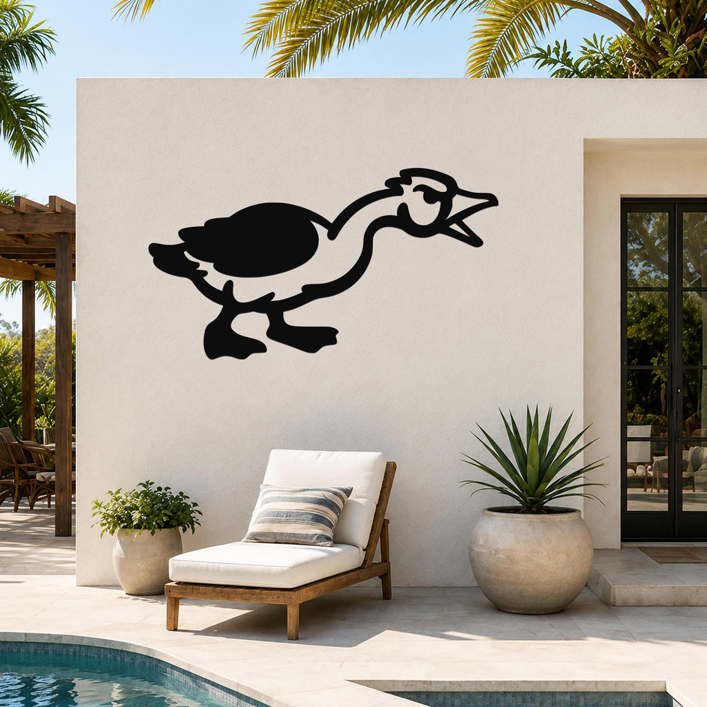 Black metal goose wall art with a minimalist silhouette design, mounted on an outdoor patio wall above a lounge chair and potted plants.