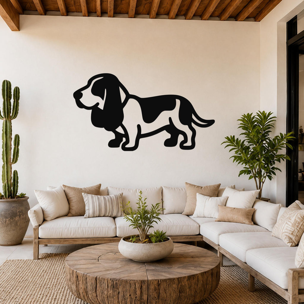 Black metal Basset Hound silhouette wall art mounted on a living room wall above a white sofa.