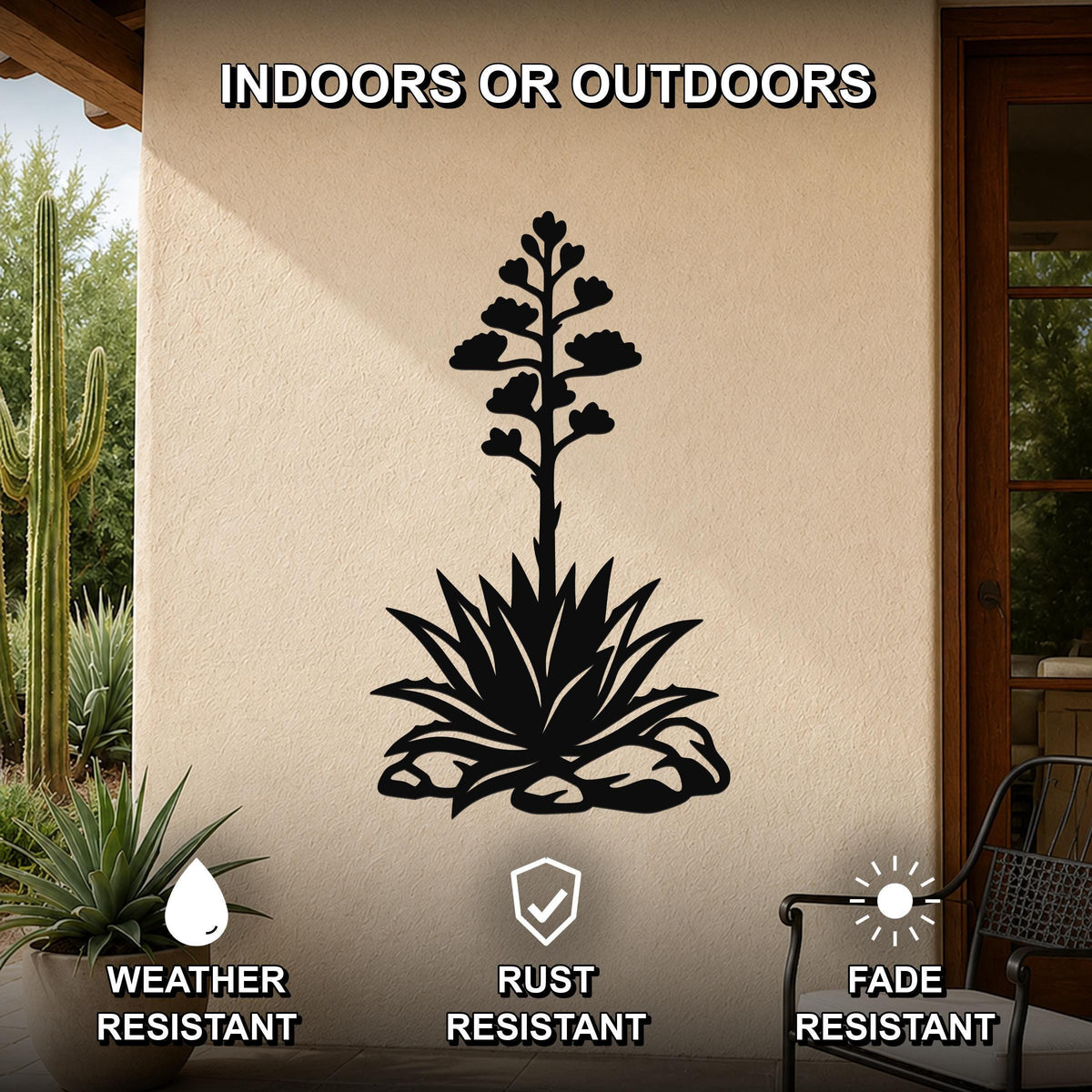 Black metal agave wall art with a blooming flower and spiky leaves cutout, mounted on an outdoor patio wall.