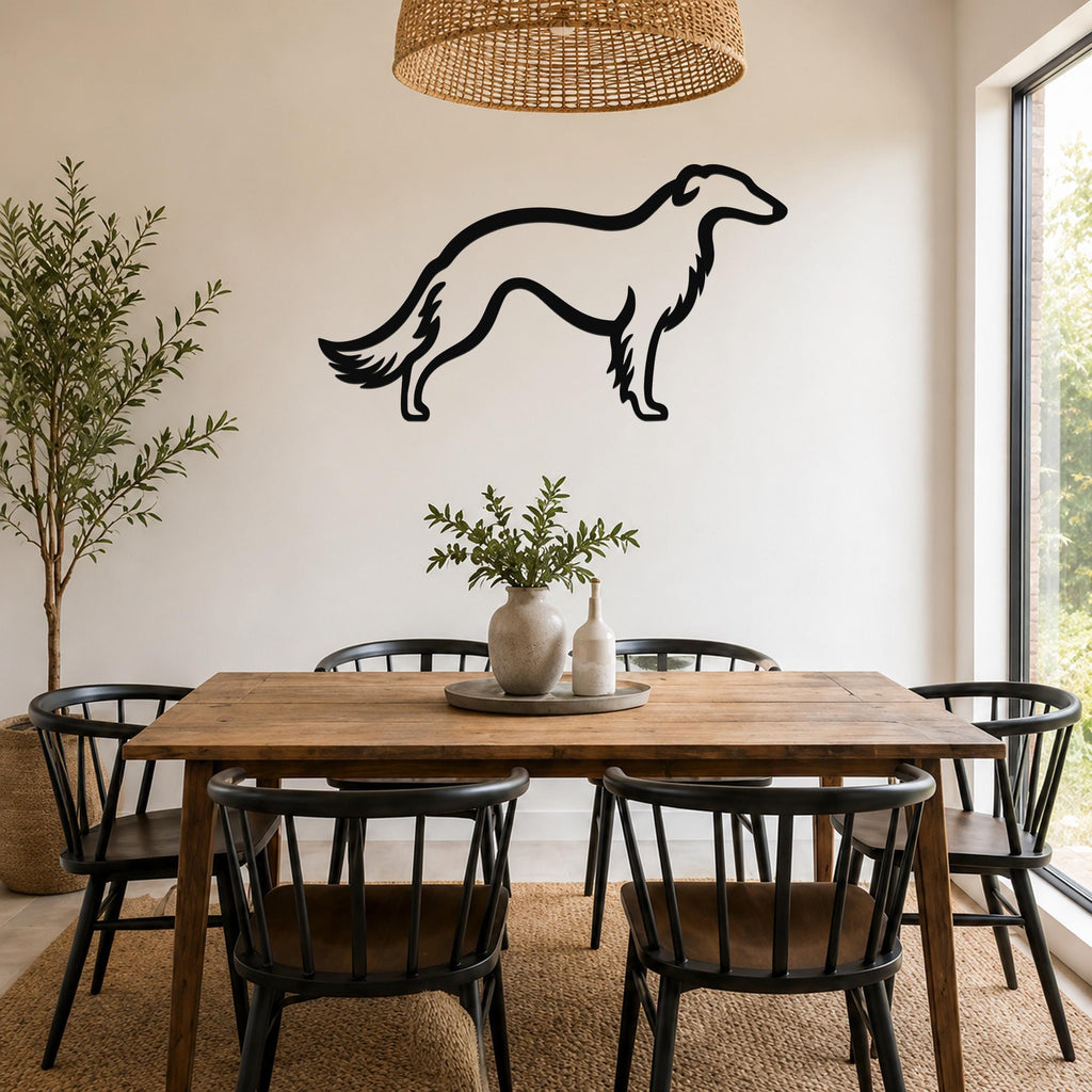 Black metal Borzoi dog silhouette wall art mounted on a white wall above a wooden dining table in a bright dining room.
