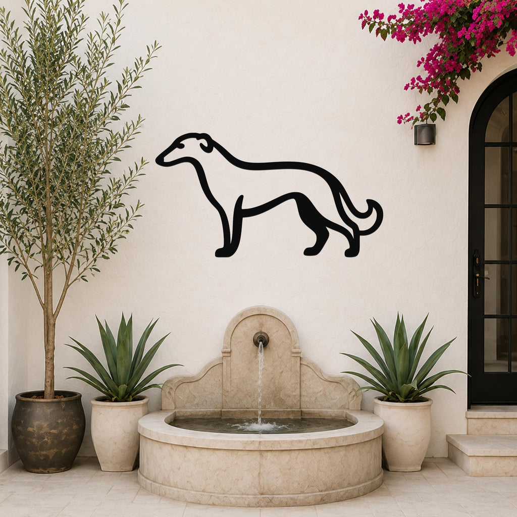 Black metal Borzoi dog silhouette wall art mounted on a white outdoor wall above a stone fountain, flanked by potted plants and a flowering vine.