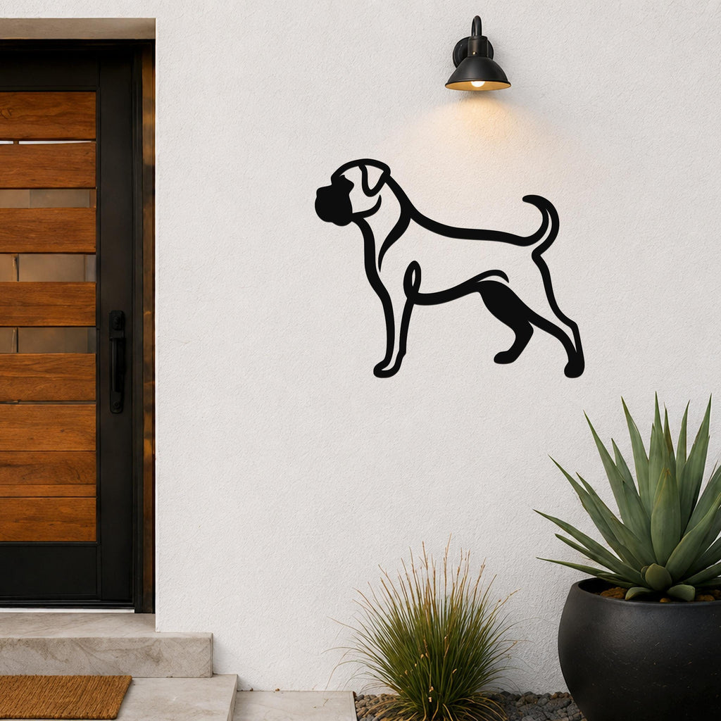 Black metal Boxer dog wall art silhouette mounted on a white exterior wall beside a wooden door, illuminated by a wall sconce.