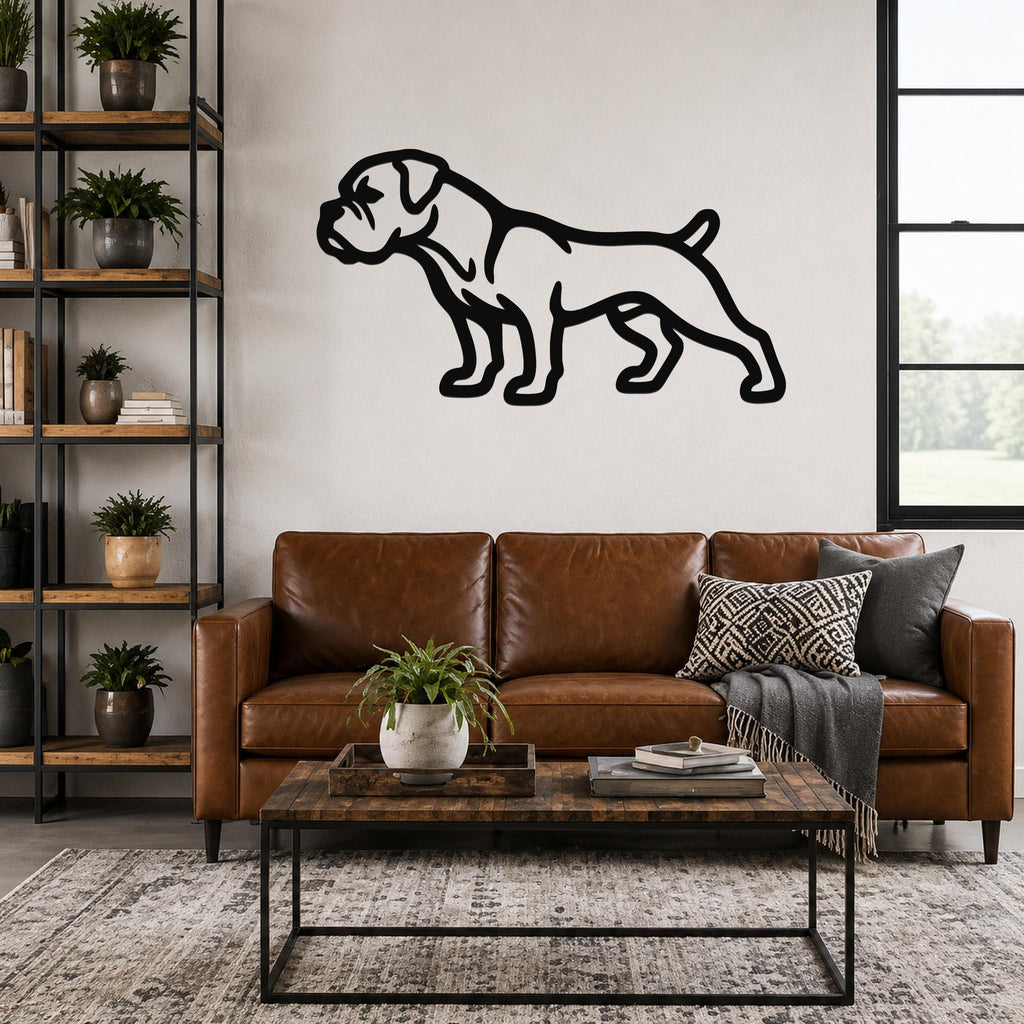 Black metal Boxer dog silhouette wall art mounted on a living room wall above a brown leather sofa.