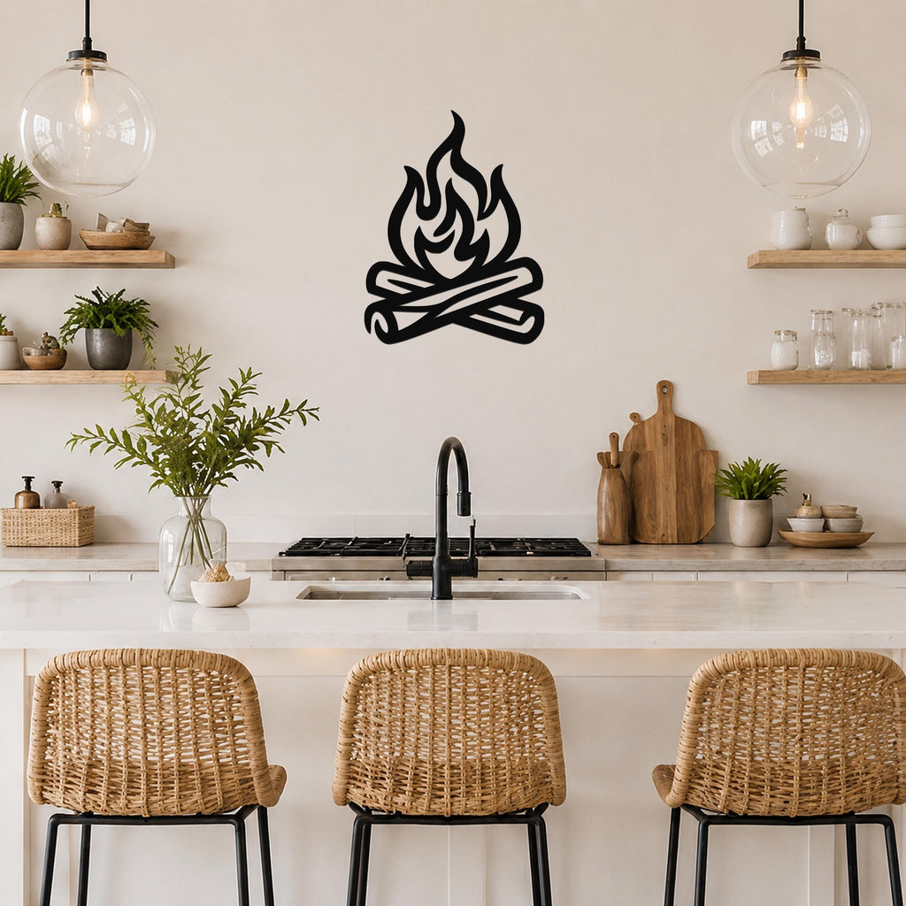 Black metal campfire wall art with flame and log silhouette, mounted on a kitchen wall above a counter.