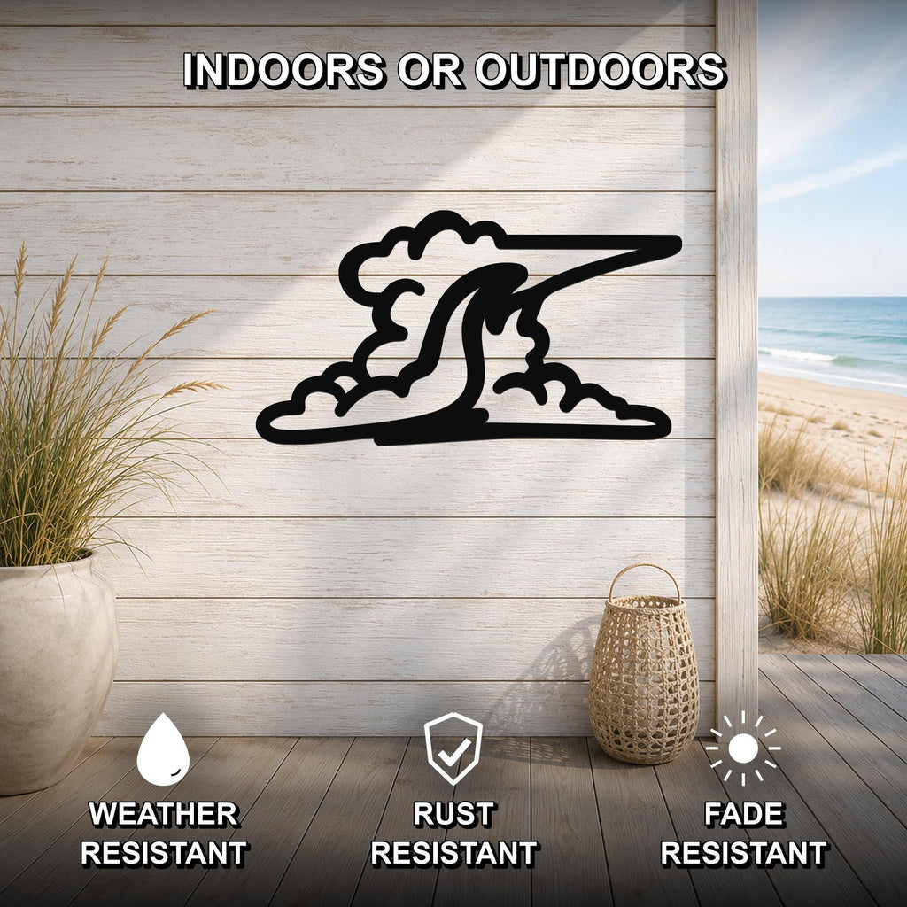 Black metal cloud wall art with a silhouette design, mounted on a light wood plank wall in a beachside patio setting.