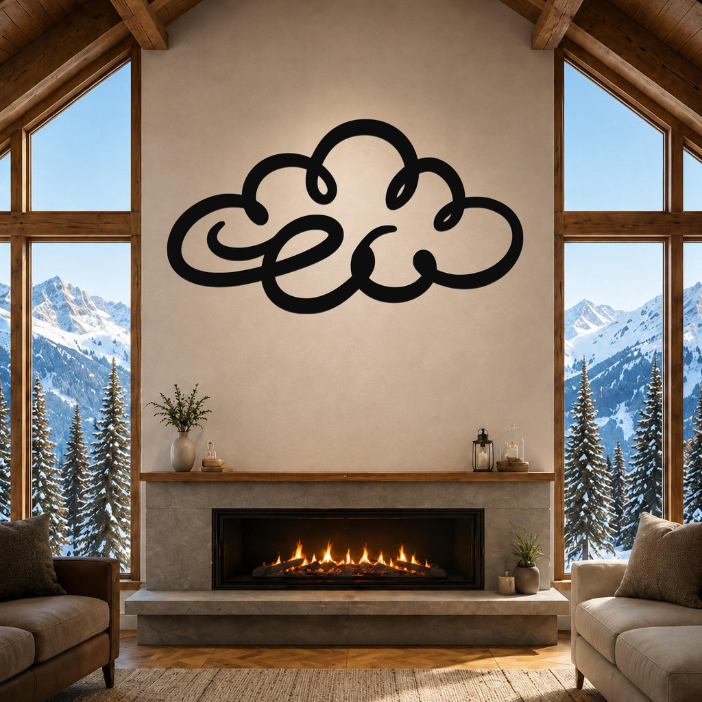 Black metal cloud wall art with flowing silhouette cutouts, mounted above a fireplace in a living room with large windows and mountain views.