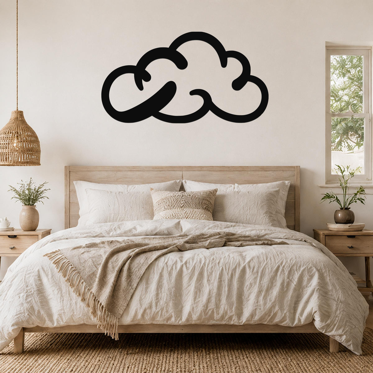 Black metal cloud wall art with a minimalist silhouette design, mounted above a wooden bed in a neutral-toned bedroom.