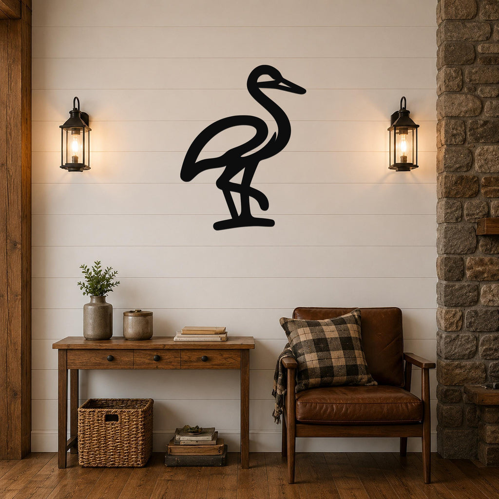 Black metal crane wall art silhouette mounted on a shiplap wall above a wooden console table in a living room.