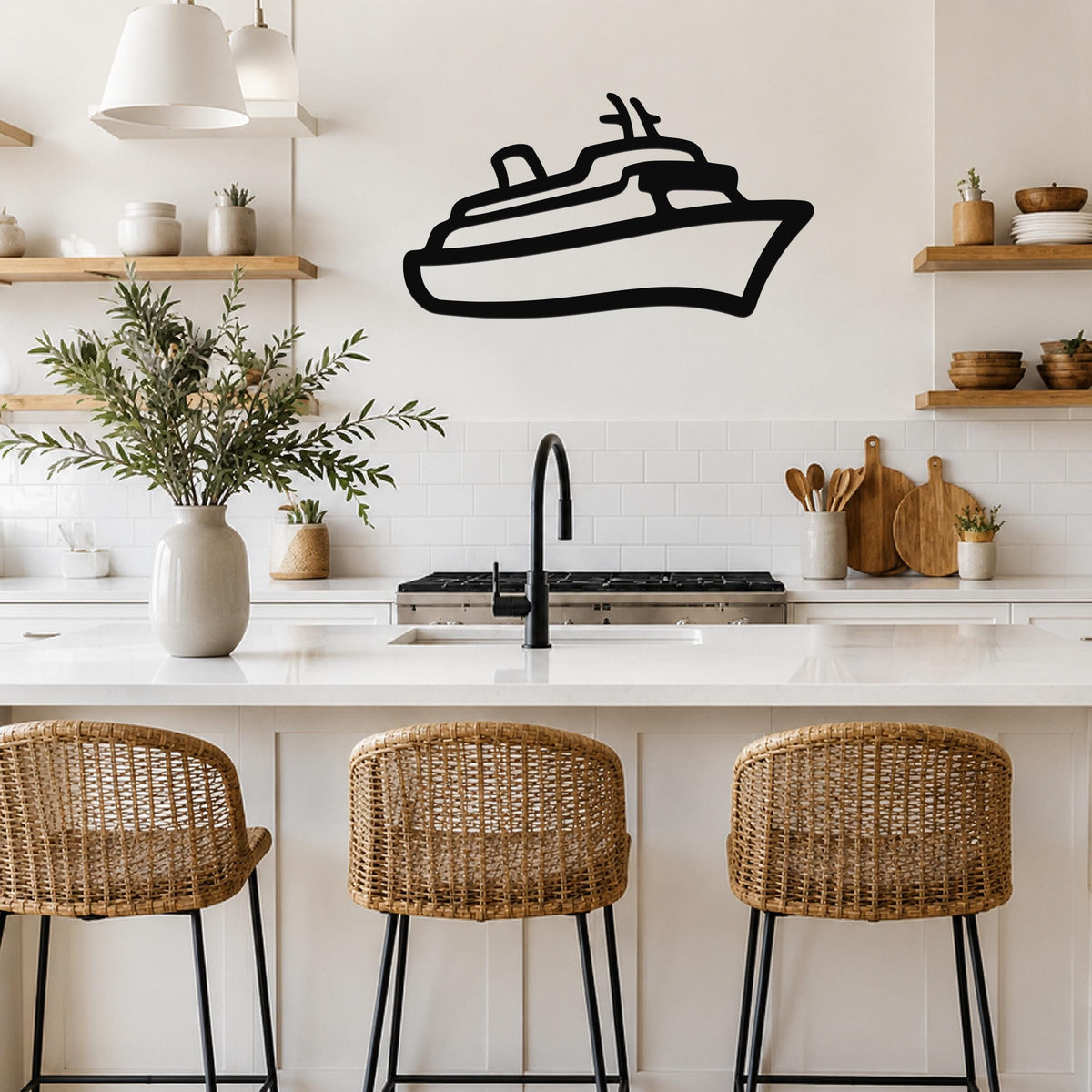 Black metal cruise ship wall art with a silhouette design, mounted on a kitchen wall above a white countertop.