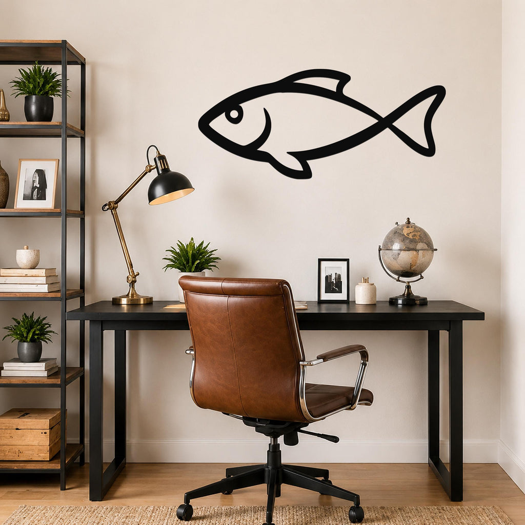 Black metal fish silhouette wall art mounted on a beige wall above a black desk in a home office.