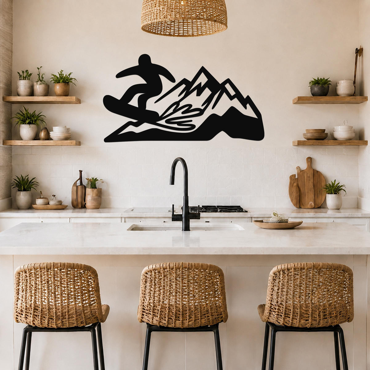Black metal wall art featuring a snowboarder silhouette on a mountain, mounted above a kitchen counter with wicker stools and open shelves.