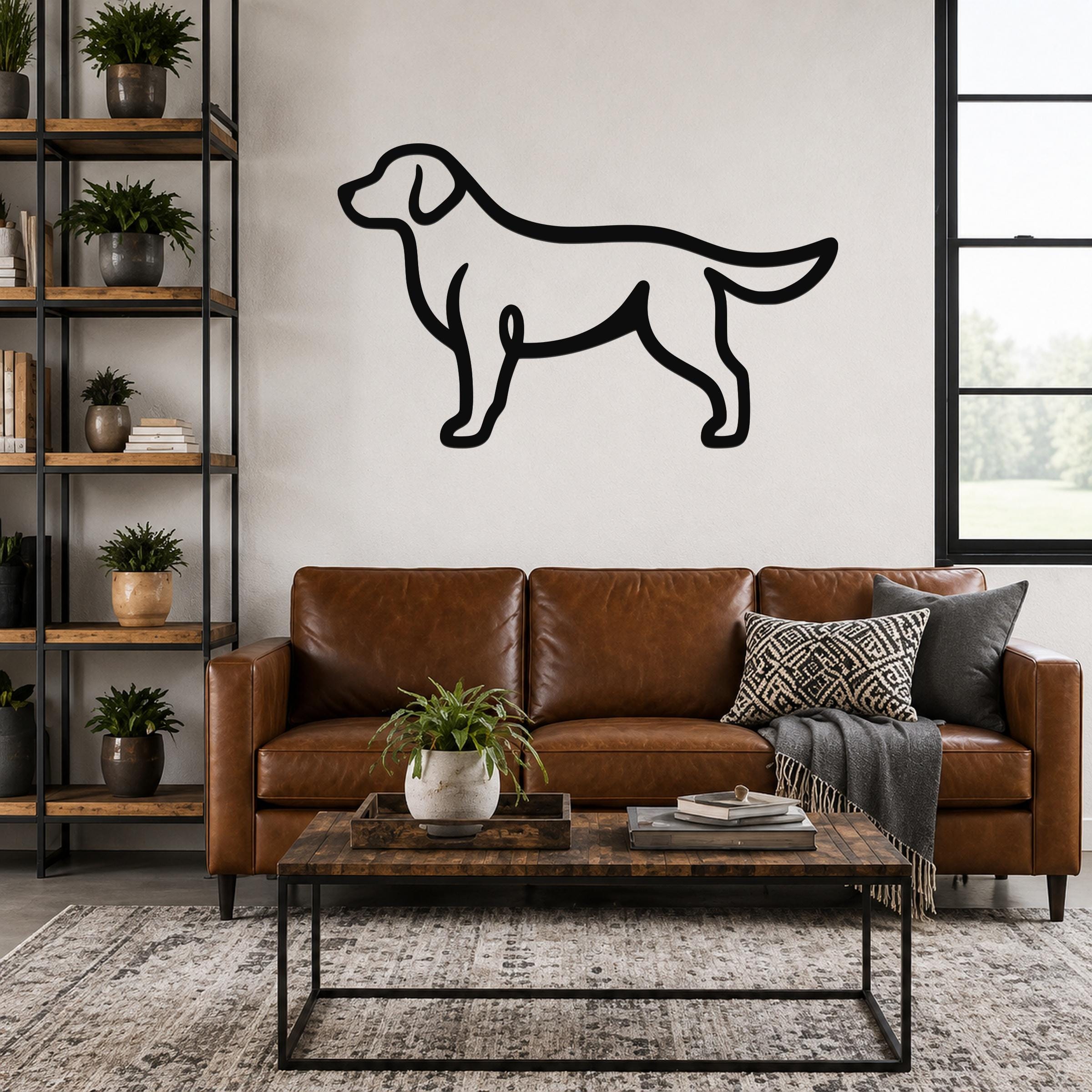 Black metal dog silhouette wall art mounted above a brown leather sofa in a living room.