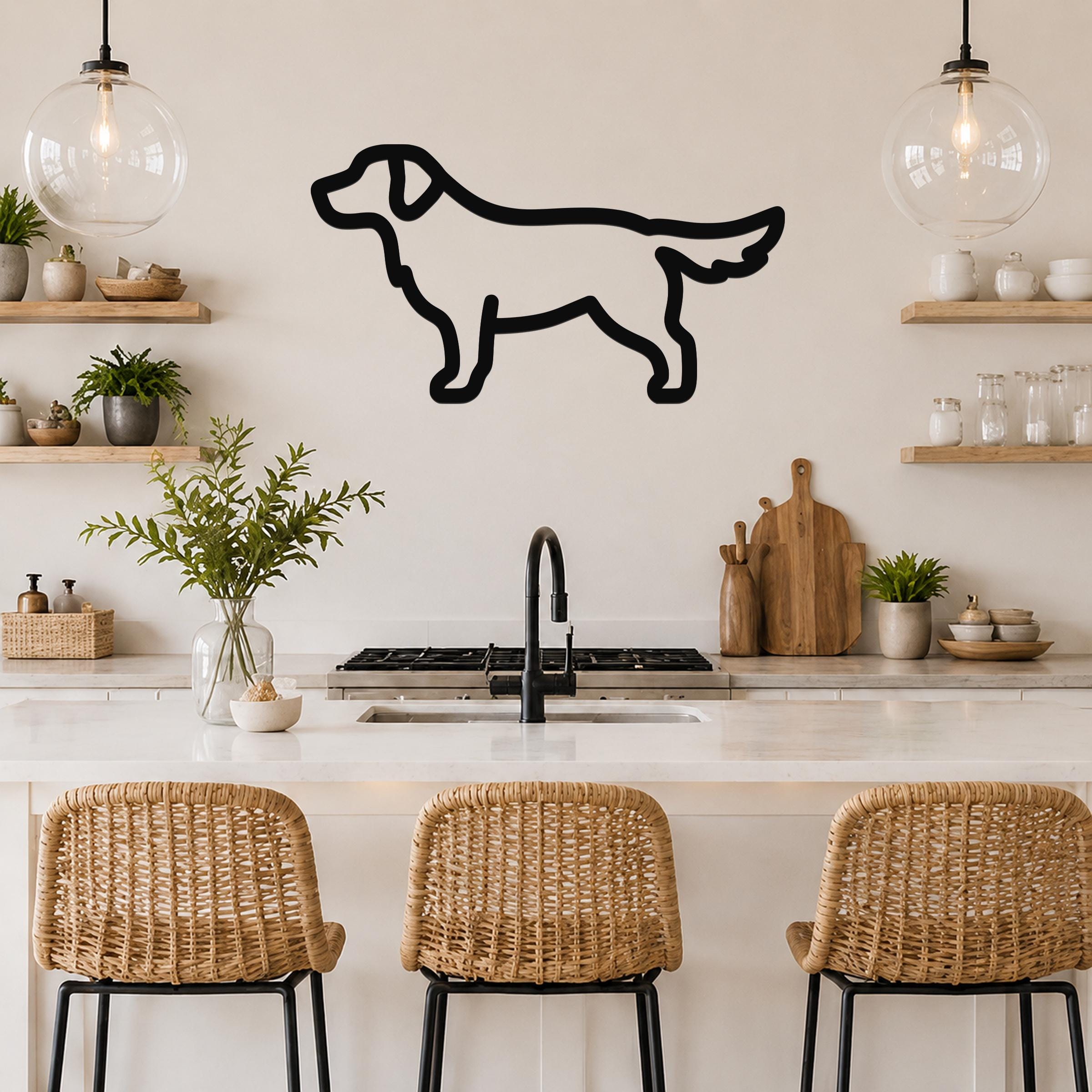 Black metal dog silhouette wall art, a golden retriever outline, mounted on a kitchen wall above a counter with wicker bar stools.