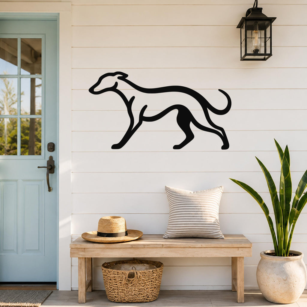 Black metal greyhound wall art silhouette mounted on a white shiplap wall above a wooden bench in a porch entryway.