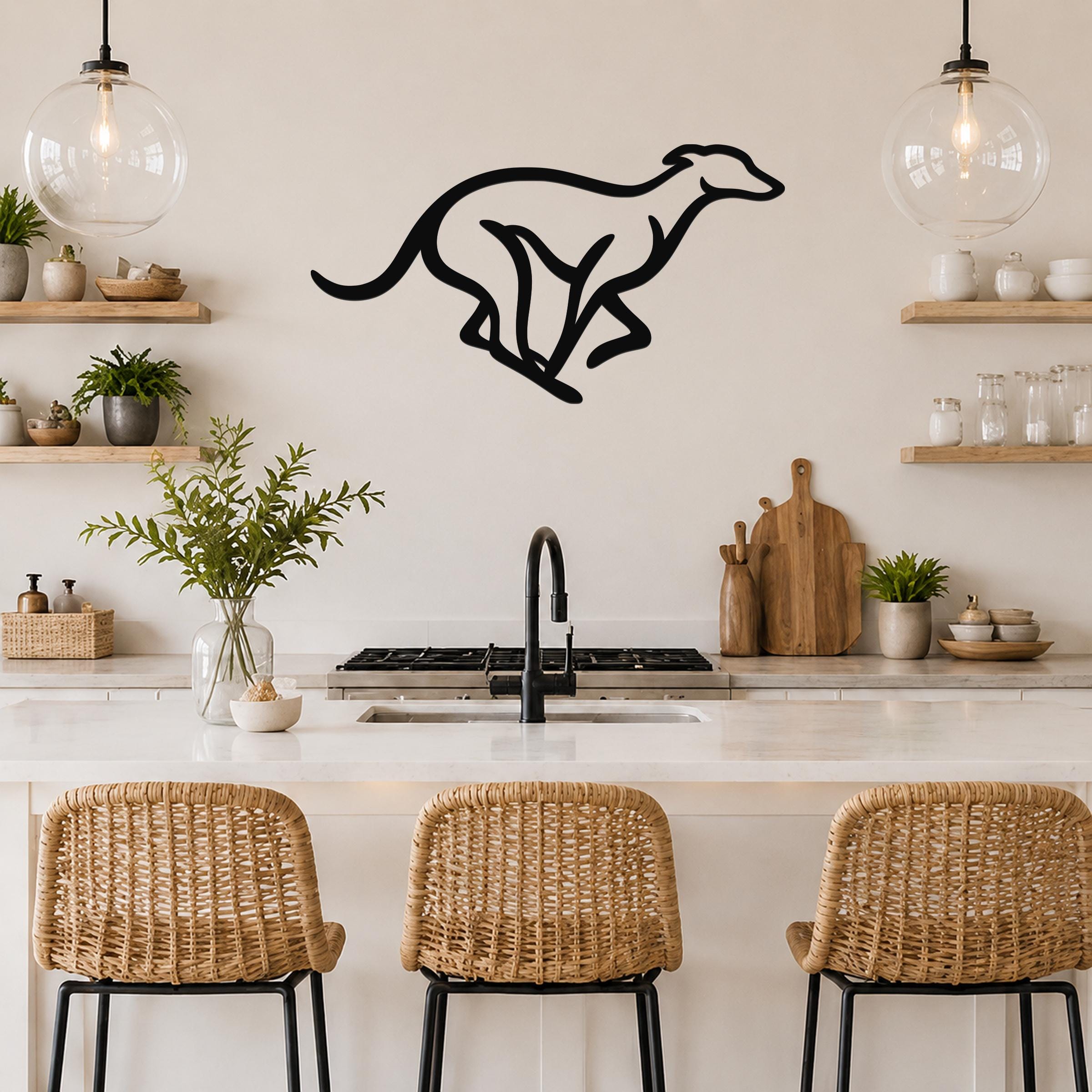 Black metal greyhound wall art with a sleek silhouette, mounted on a kitchen wall above a counter.