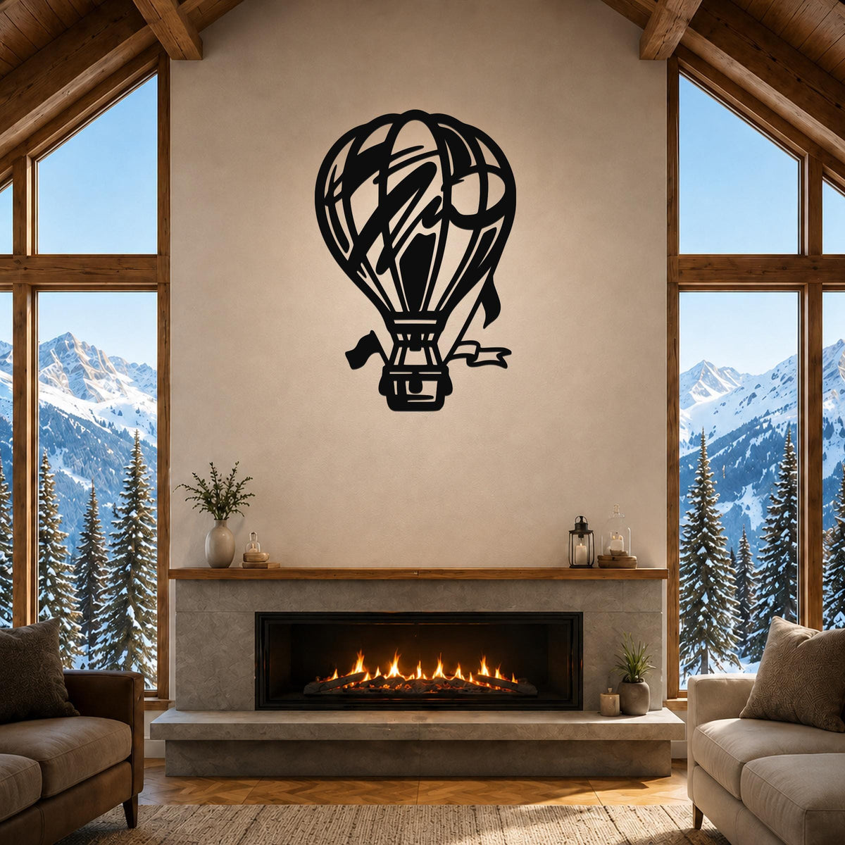 Black metal hot air balloon wall art with internal cutout details, mounted above a fireplace in a living room with large windows and mountain views.