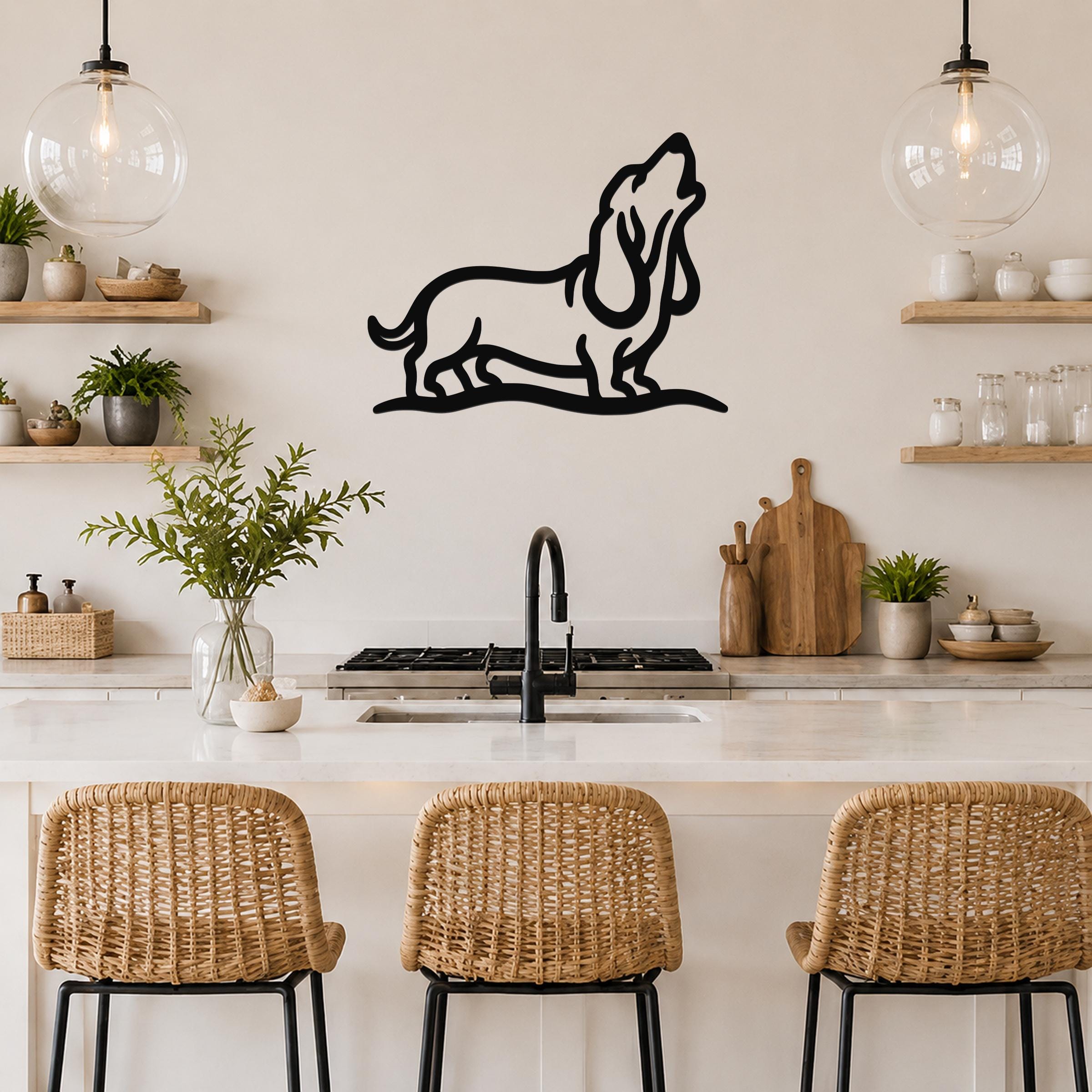 Black metal wall art of a howling basset hound silhouette, mounted on a kitchen wall above a counter with wicker bar stools.