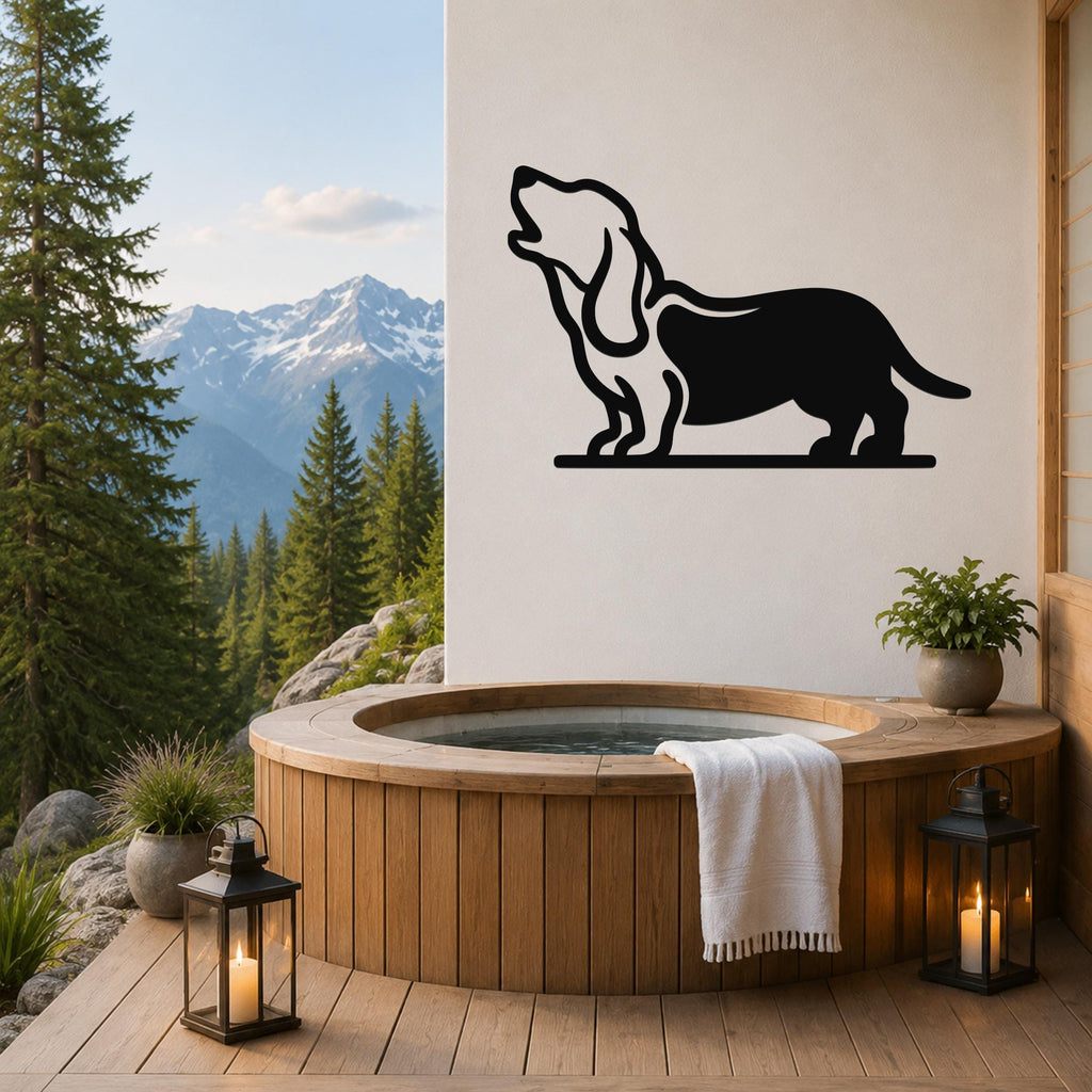 Black metal wall art of a howling basset hound silhouette, mounted on a white wall above a wooden hot tub on a mountain-view deck.