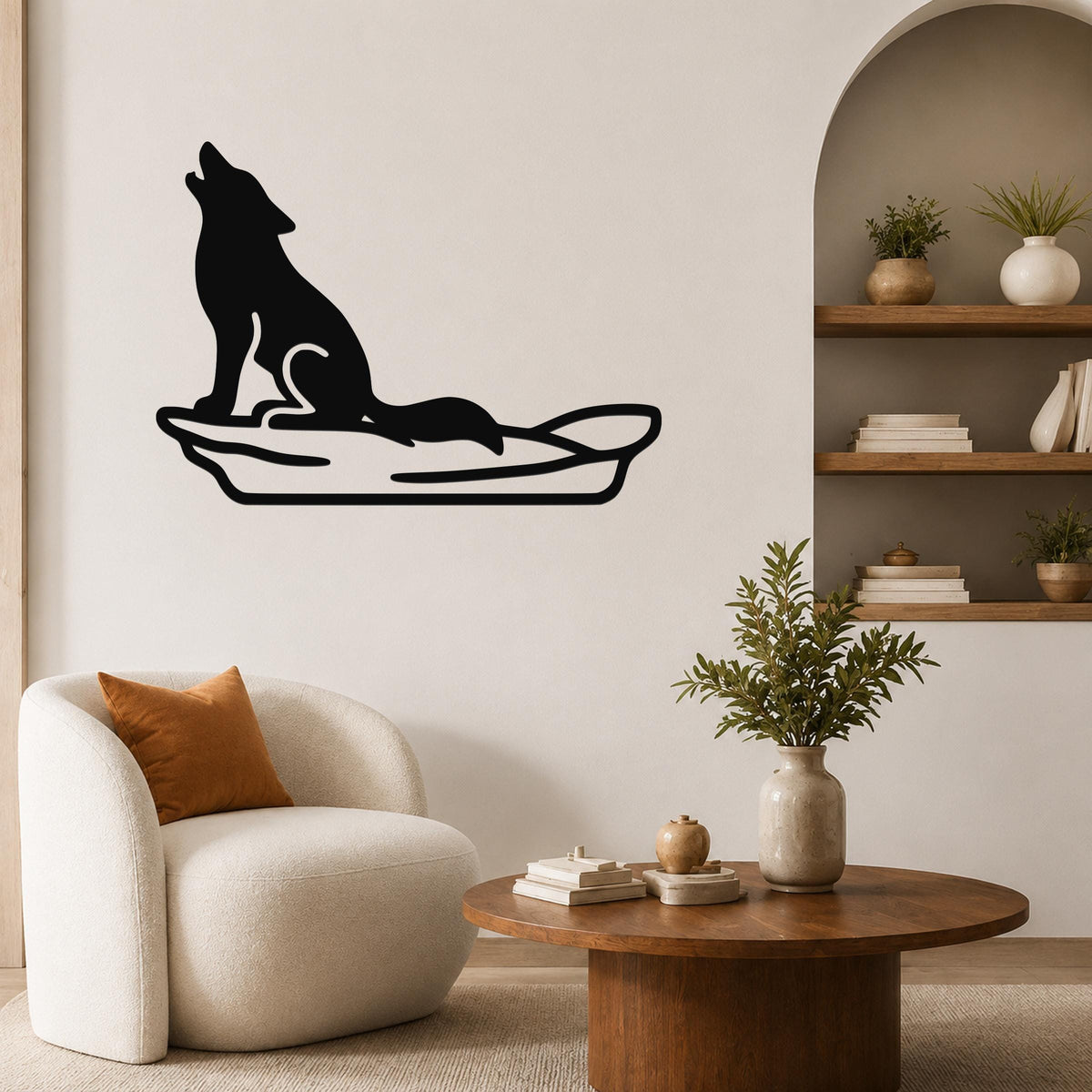 Black metal wall art of a howling coyote silhouette on a sled, mounted on a living room wall above a white armchair.