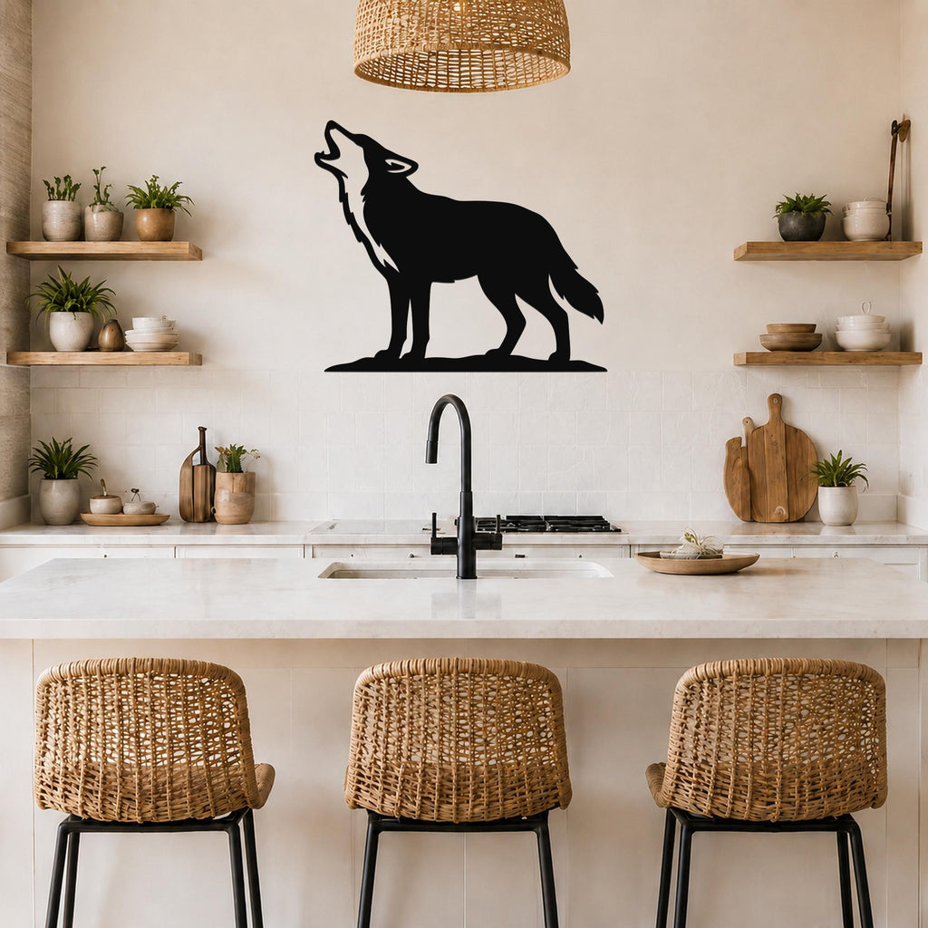 Black metal coyote wall art in a howling silhouette, mounted on a kitchen wall above a counter with wicker bar stools.