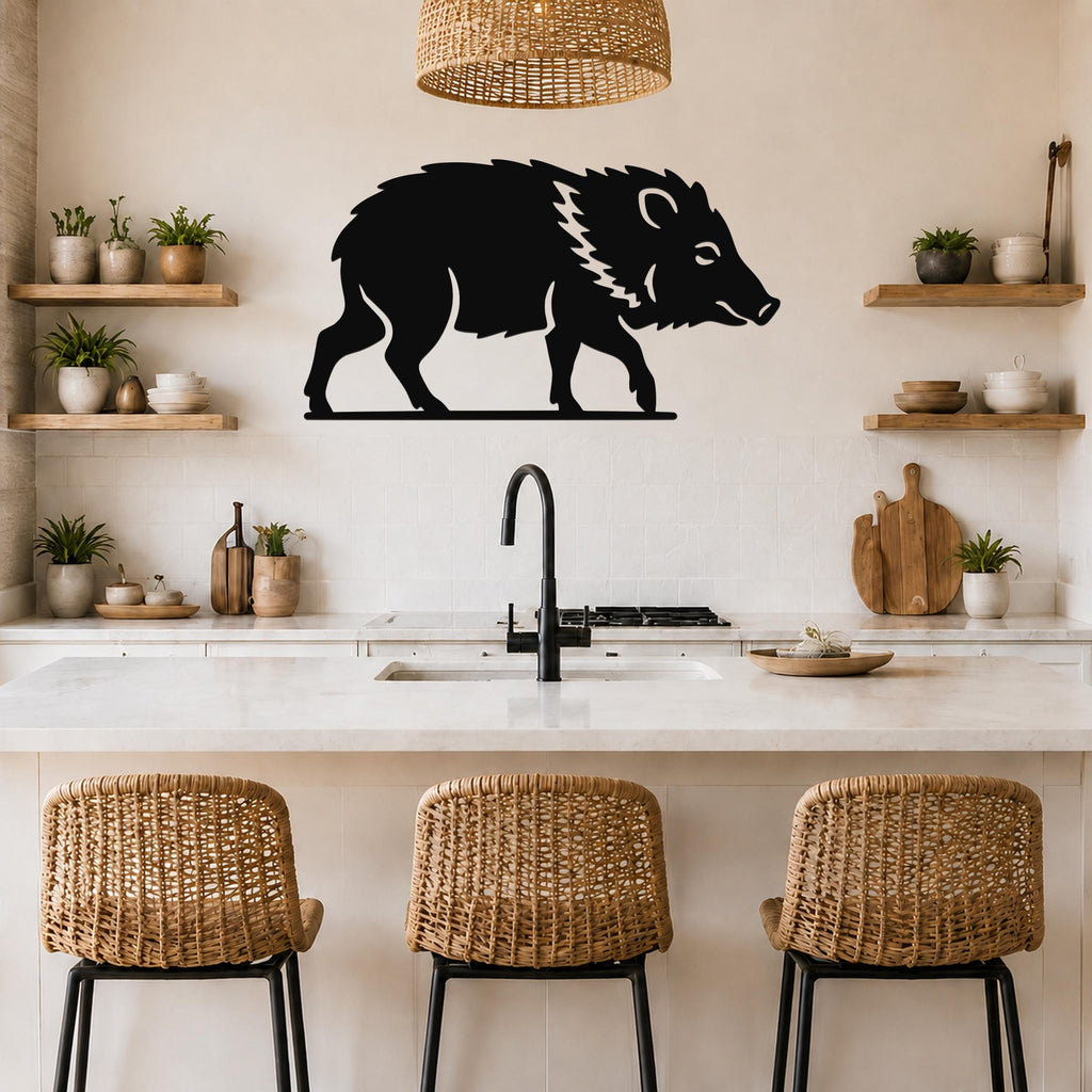 Black metal javelina wall art silhouette with white line details, mounted on a kitchen wall above a counter.