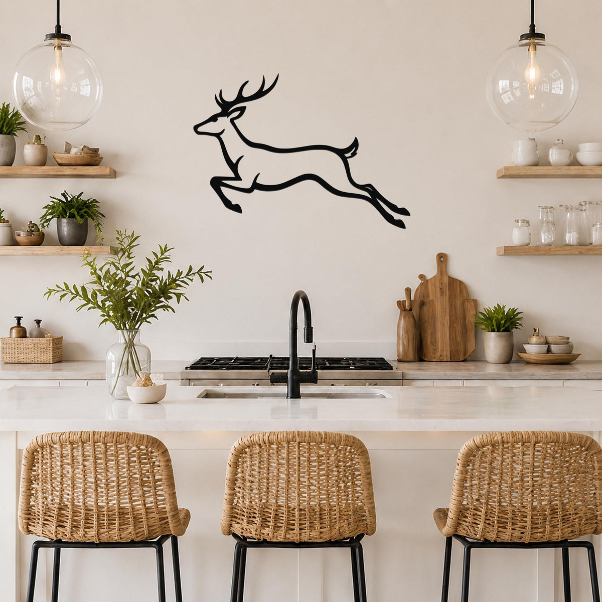 Black metal wall art of a jumping deer silhouette, mounted on a kitchen wall above a counter with wicker bar stools.