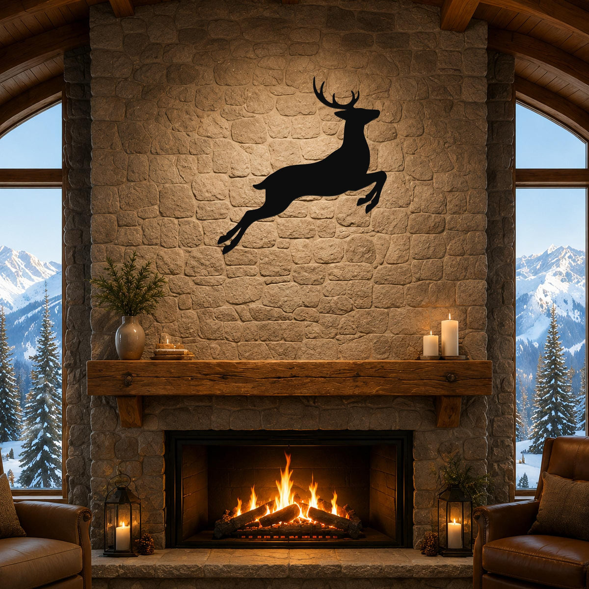 Black metal jumping deer wall art silhouette mounted above a stone fireplace in a rustic living room with mountain views.