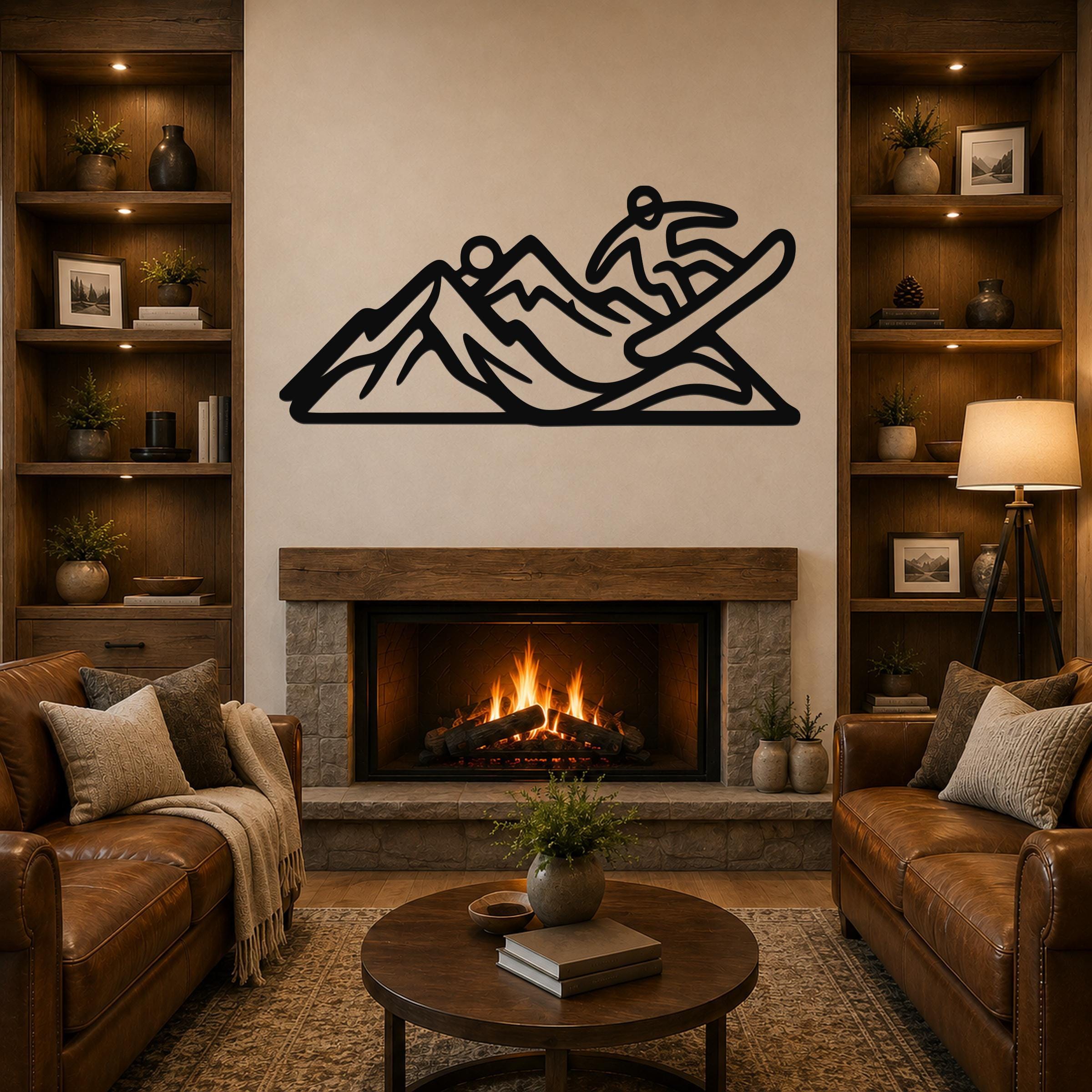 Black metal wall art silhouette of a snowboarder in motion over mountain peaks, mounted above a fireplace in a living room.