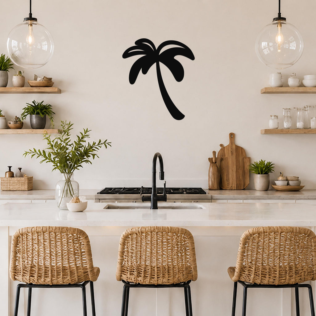 Black metal palm tree wall art silhouette mounted on a kitchen wall above a counter, with wicker bar stools and pendant lights visible below.