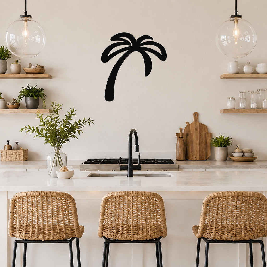 Black metal palm tree wall art silhouette mounted on a kitchen wall above a counter, with wicker bar stools and open shelves visible below.