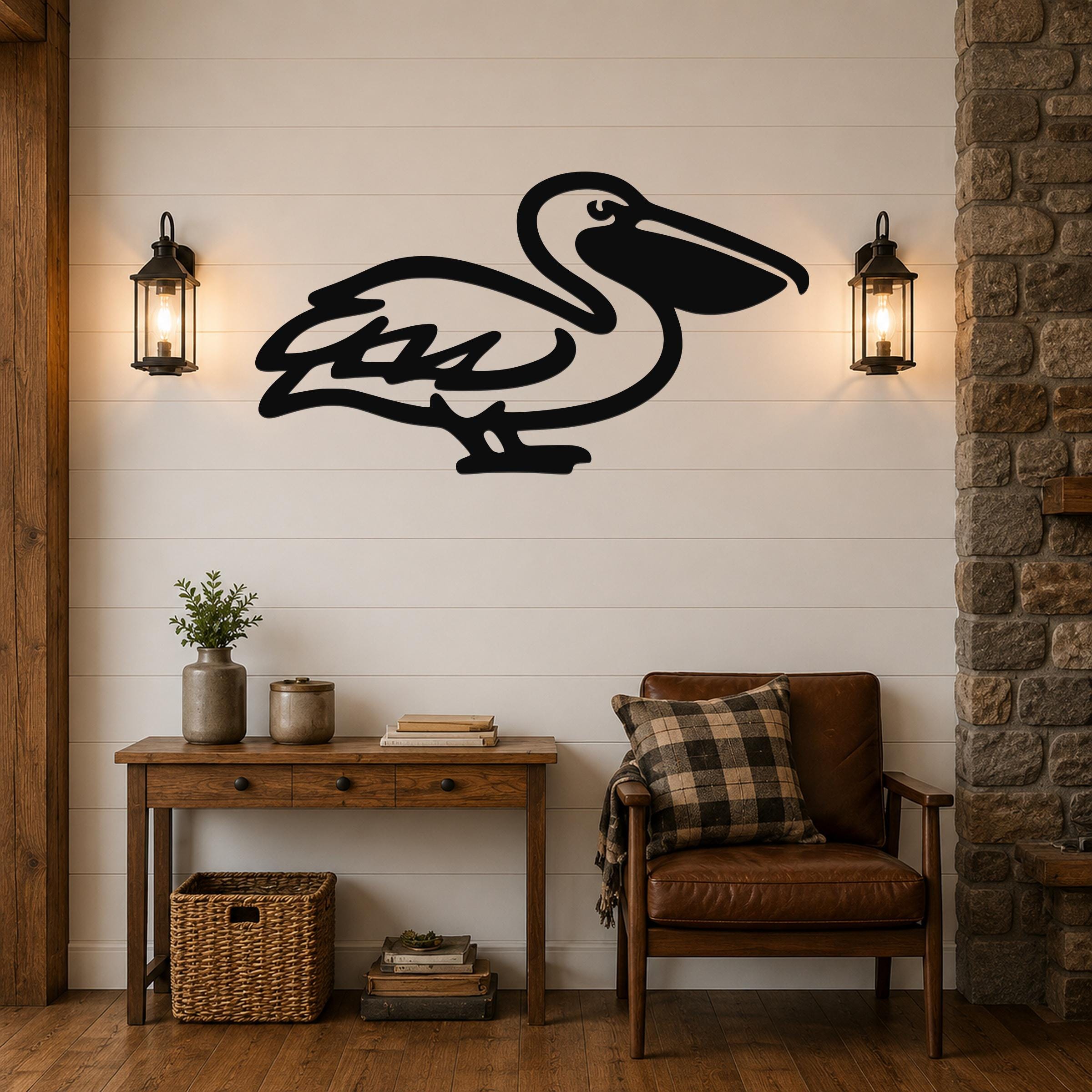 Black metal pelican wall art silhouette mounted on a shiplap wall above a wooden console table in a living room.