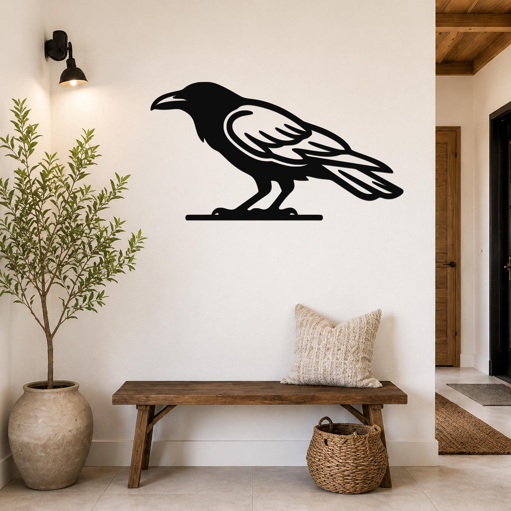Black metal raven wall art silhouette mounted on a white wall above a wooden bench in a hallway.