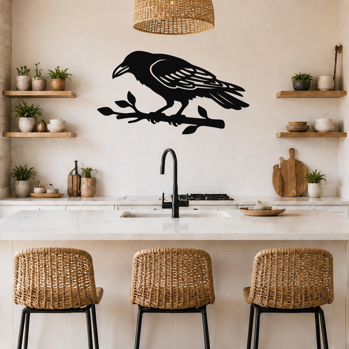 Black metal raven wall art cutout perched on a branch, mounted above a kitchen counter with wicker stools and wooden shelves.