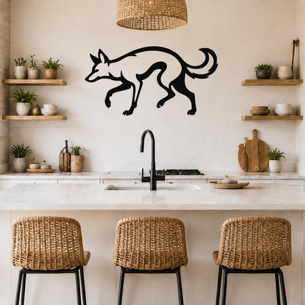 Black metal coyote wall art silhouette with motion-line cutouts, mounted above a kitchen counter in a modern rustic kitchen.