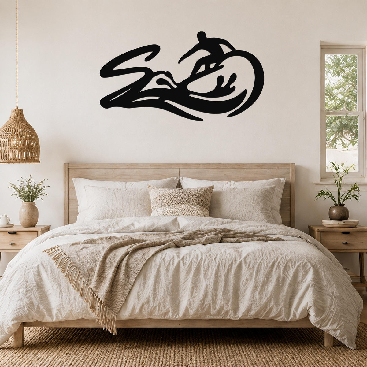 Black metal surfer wall art with wave and motion-line cutouts, mounted above a bed in a neutral bedroom.
