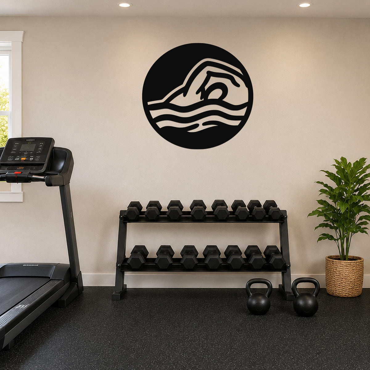 Black metal wall art with a swimmer silhouette and wavy motion lines, mounted on a wall above a dumbbell rack in a home gym.