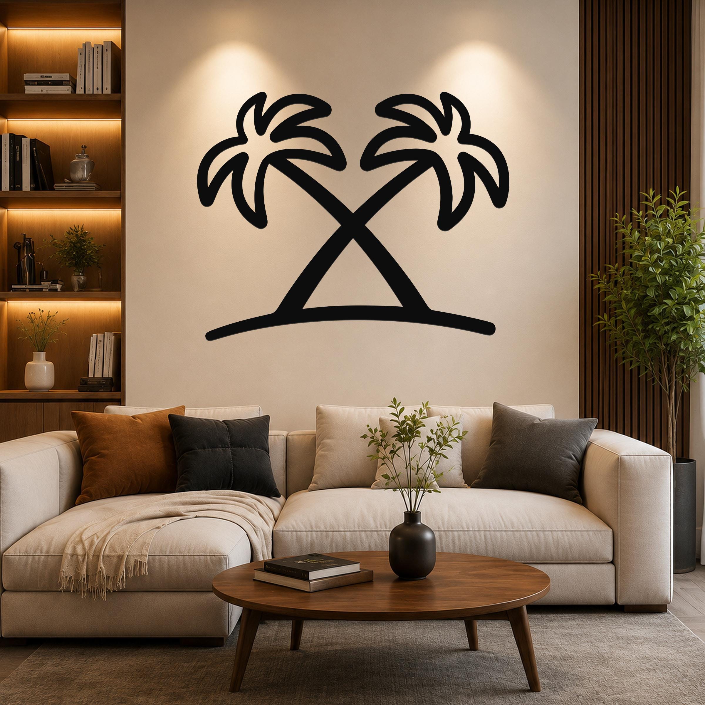 Black metal palm tree wall art with two crossed silhouettes, mounted above a beige sofa in a living room.