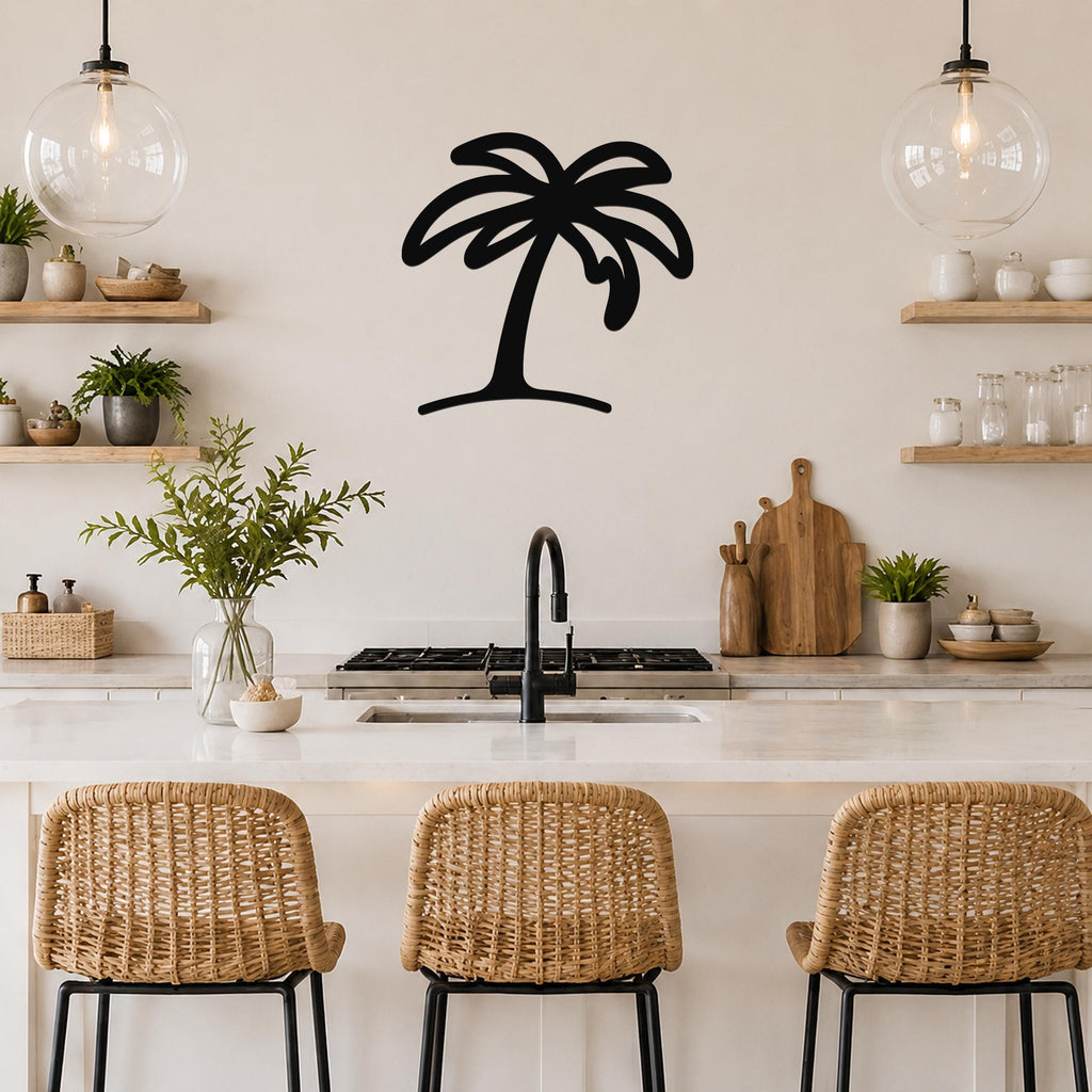 Black metal palm tree wall art with a silhouette design, mounted on a kitchen wall above a counter with wicker bar stools.
