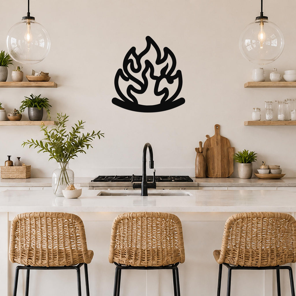 Black metal flame wall art with fluid motion cutouts, mounted on a kitchen wall above a counter.