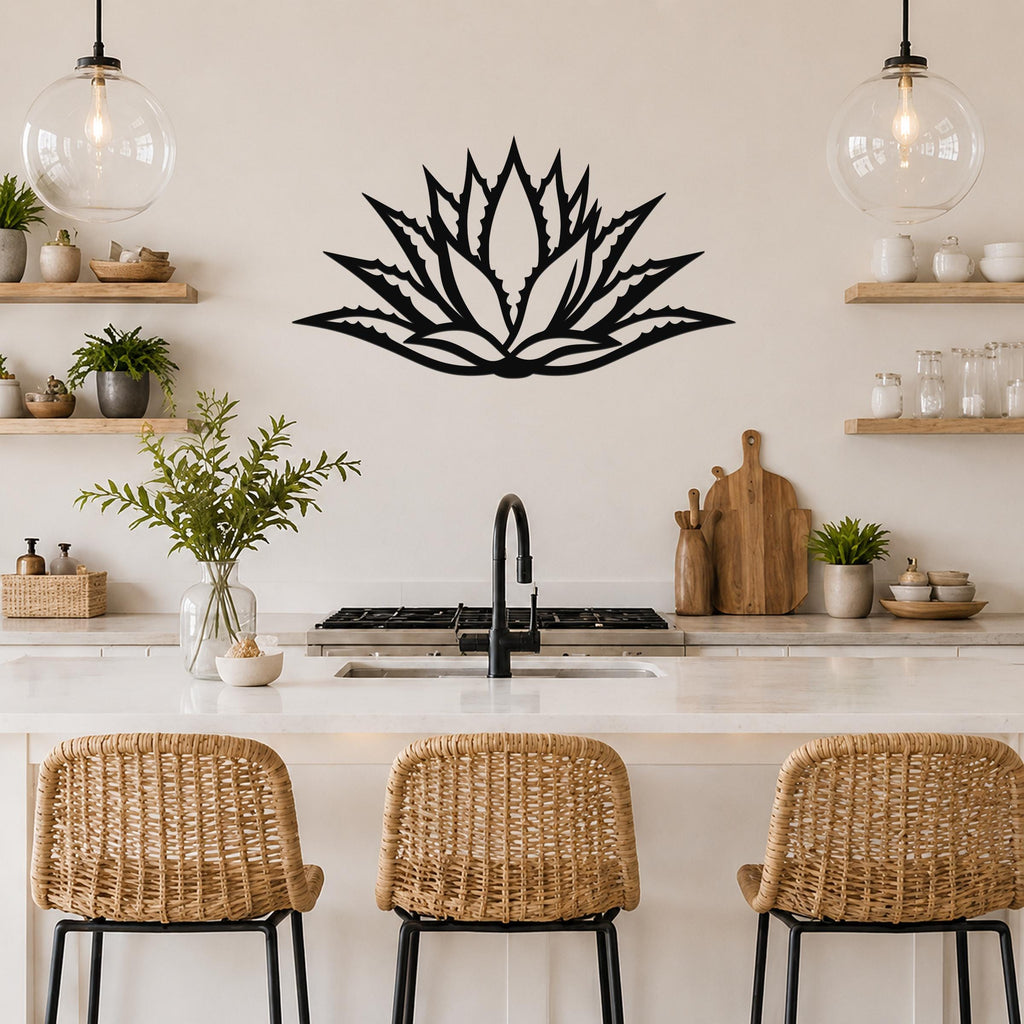 Black metal agave wall art with a bold geometric cutout design, mounted on a kitchen wall above a counter.