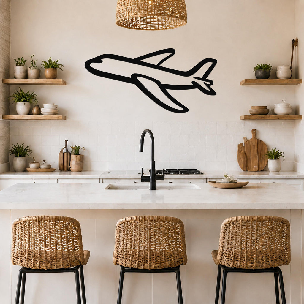 Black metal airplane wall art with a bold silhouette design, mounted on a kitchen wall above a counter with wicker bar stools.