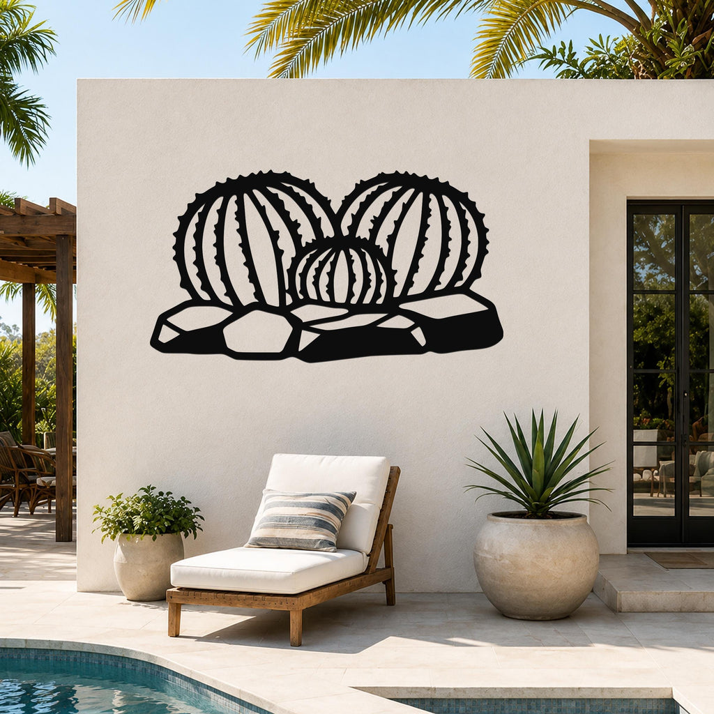 Black metal barrel cactus wall art with ribbed cutouts, mounted on an outdoor wall above a lounge chair near a pool.