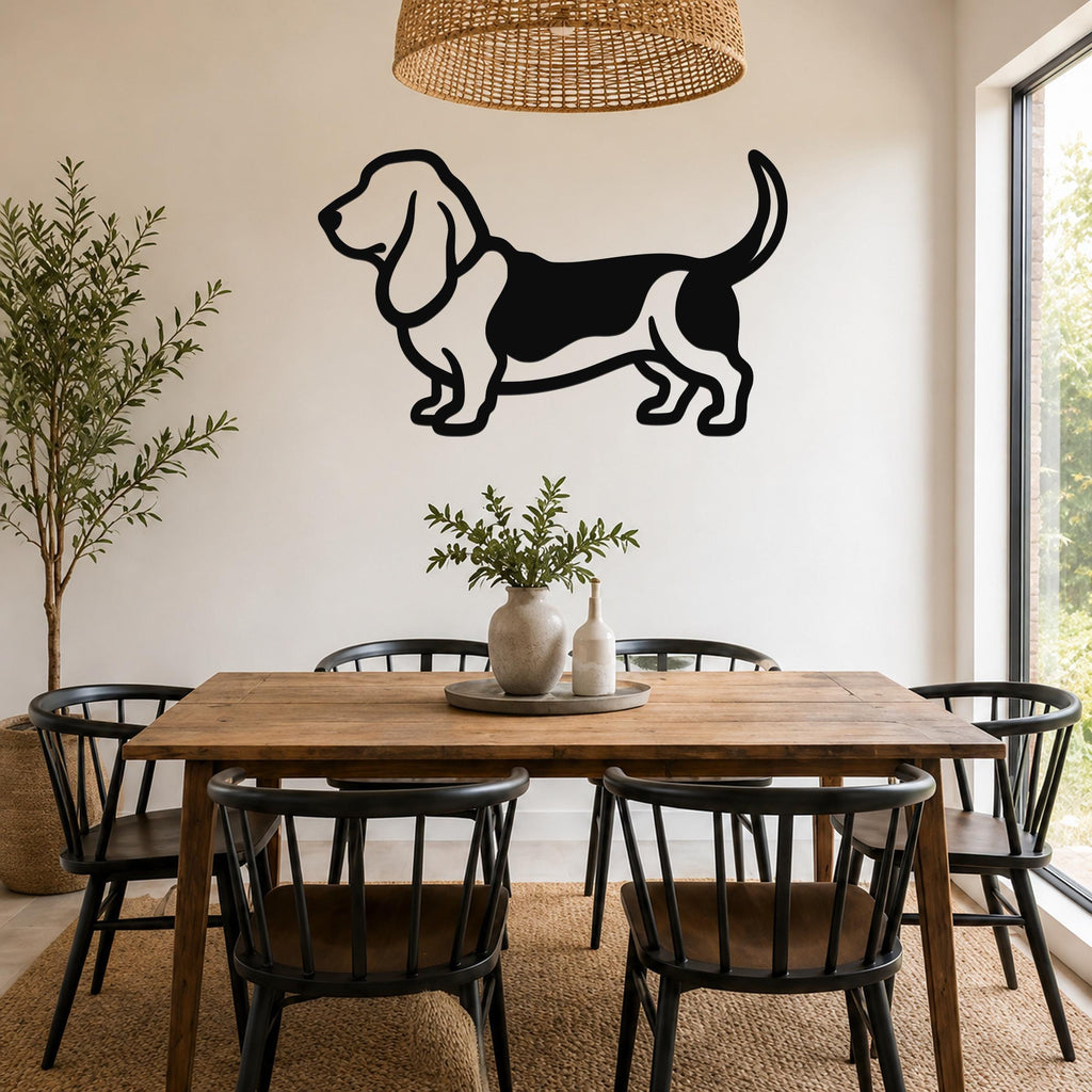 Black metal Basset Hound wall art silhouette mounted on a dining room wall above a wooden table.