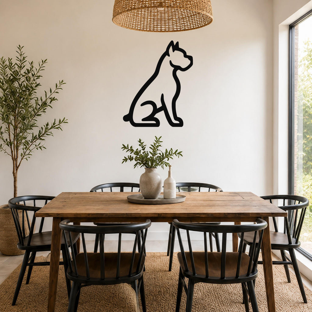 Black metal Boxer dog silhouette wall art mounted on a white wall above a wooden dining table in a bright dining room.